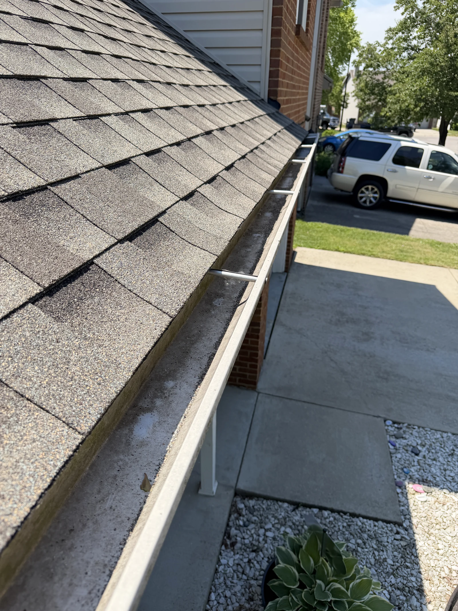 Front roof gutter following debris removal
