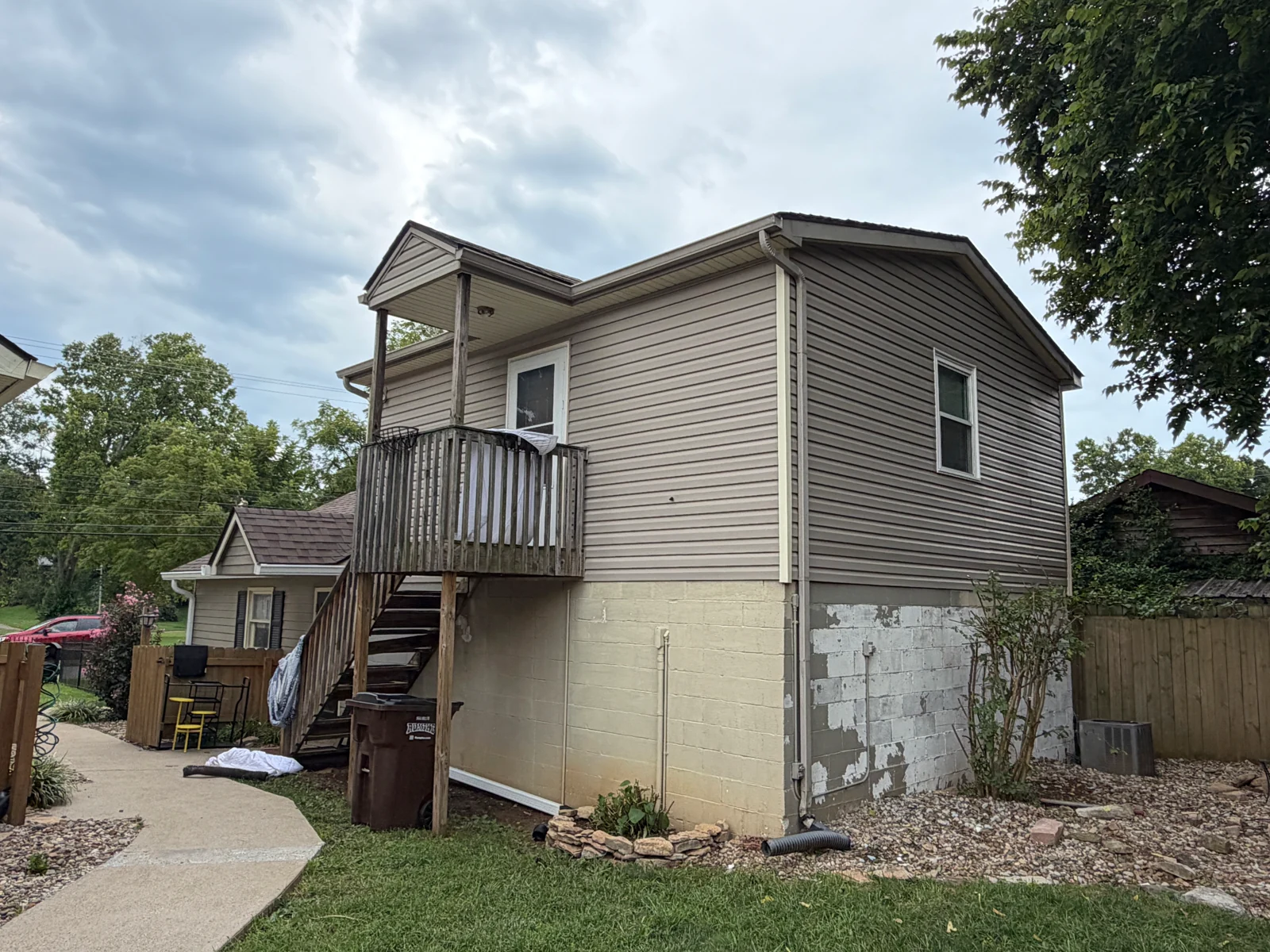 Upper Exterior and Foundation — Before on a house repaint by Arorix Home Solutions
