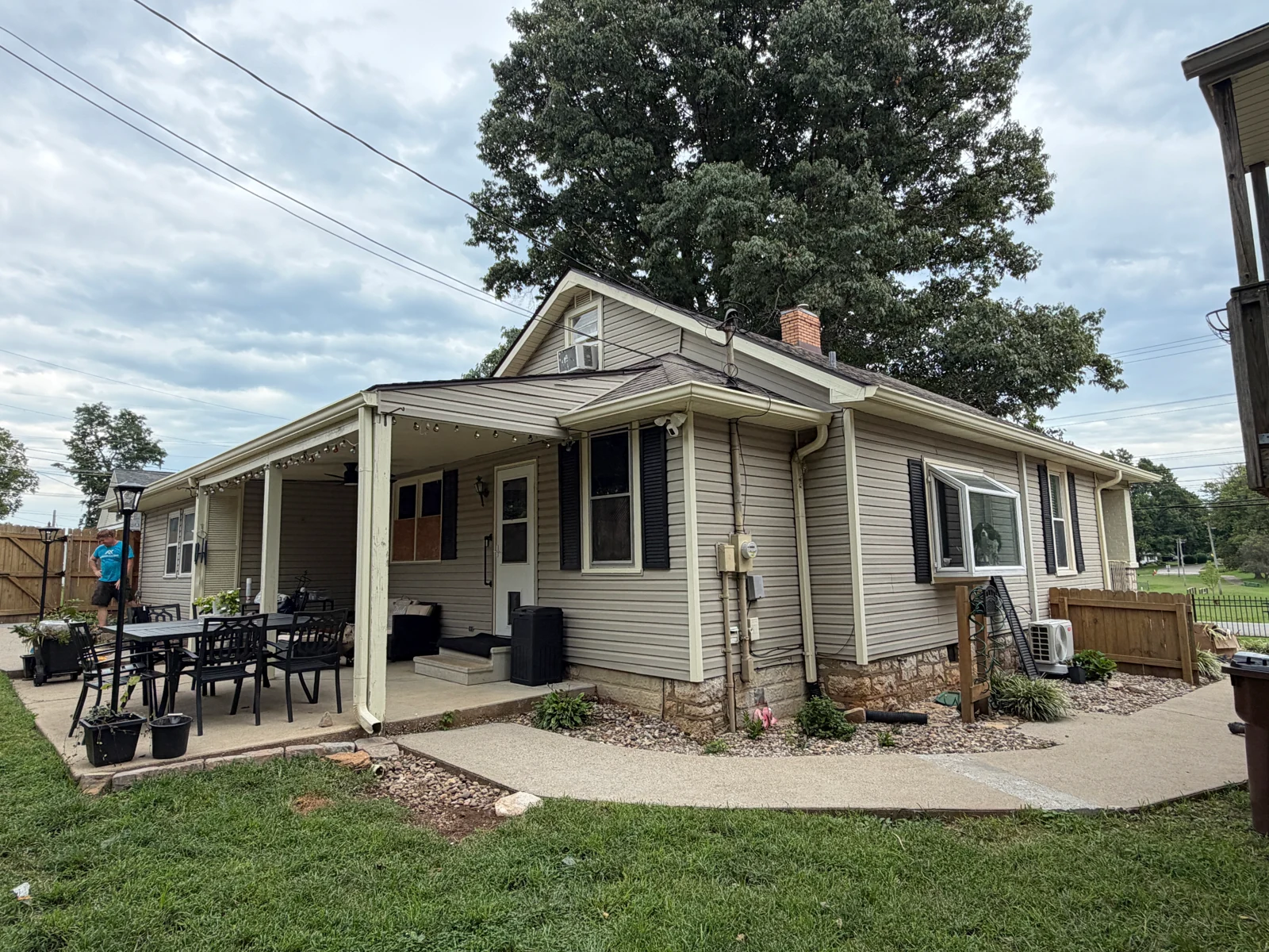 Patio Exterior — Before on a house repaint by Arorix Home Solutions