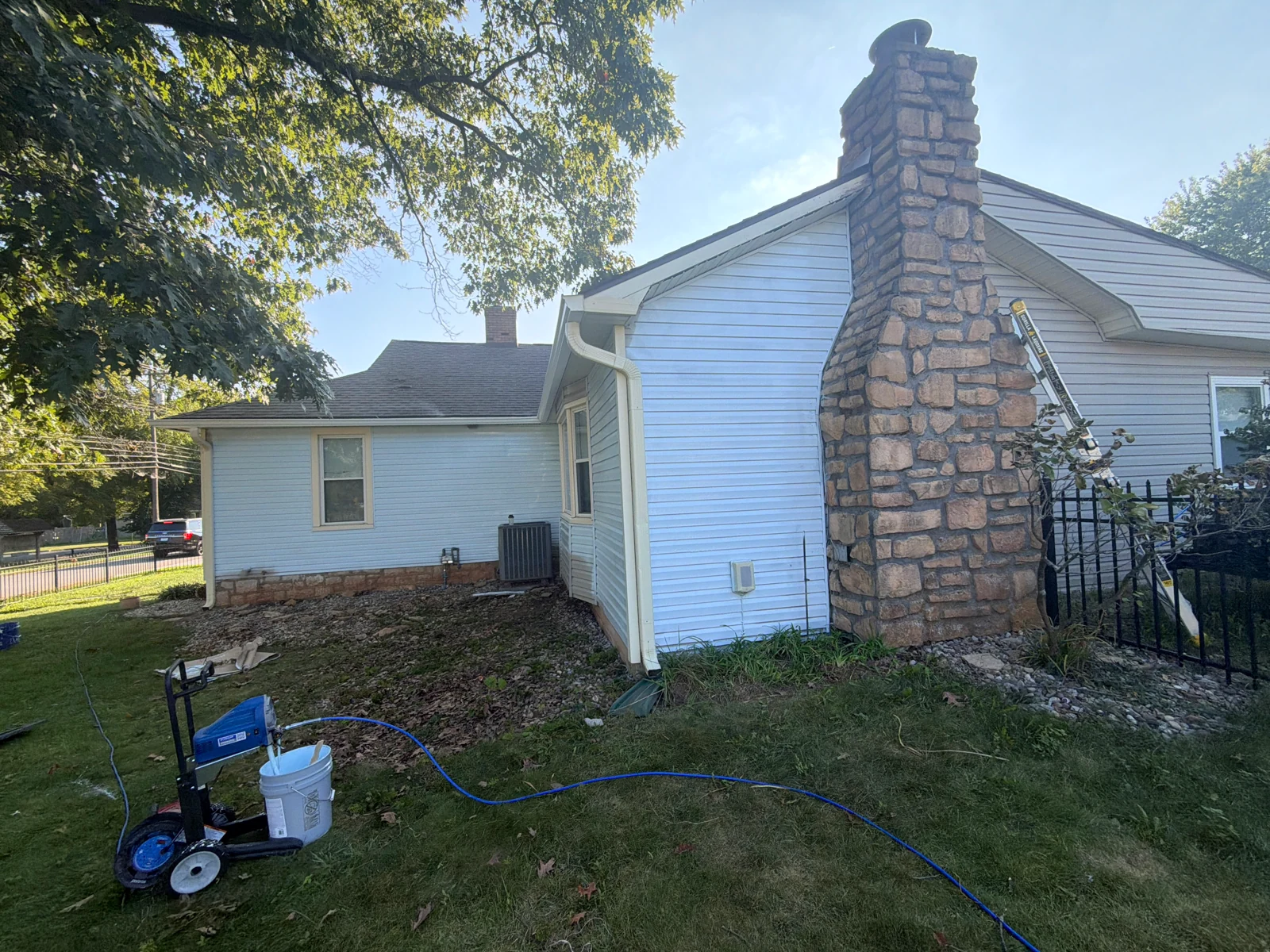 Chimney Elevation — Repainting in Progress on a house repaint by Arorix Home Solutions