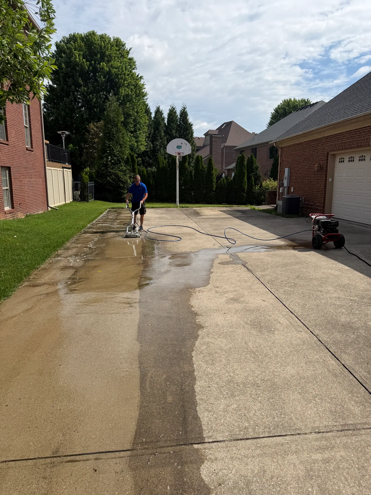 Arorix technician surface cleaning a residential concrete driveway in Georgetown Kentucky