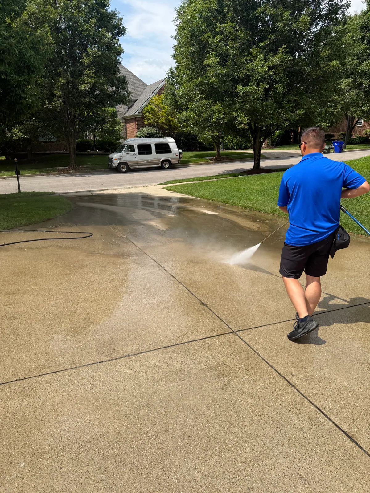 Arorix technician pressure washing a Georgetown Kentucky driveway