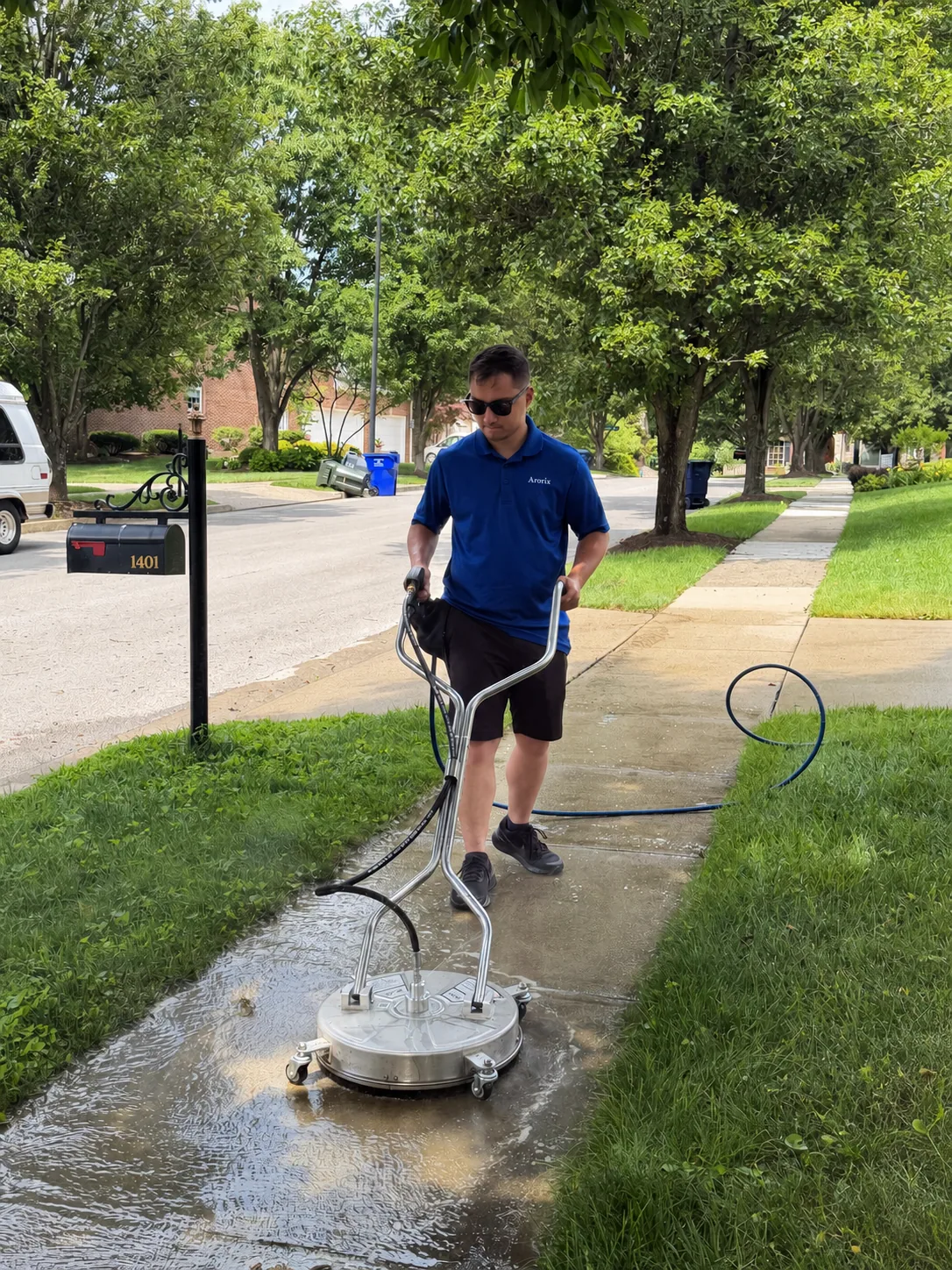 Arorix technician surface cleaning a residential sidewalk in Georgetown Kentucky