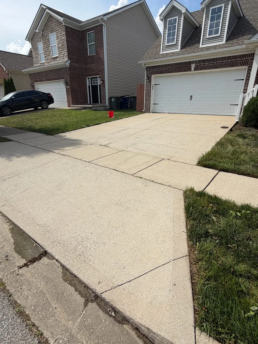 Clean residential concrete driveway after pressure washing by Arorix in Lexington Kentucky