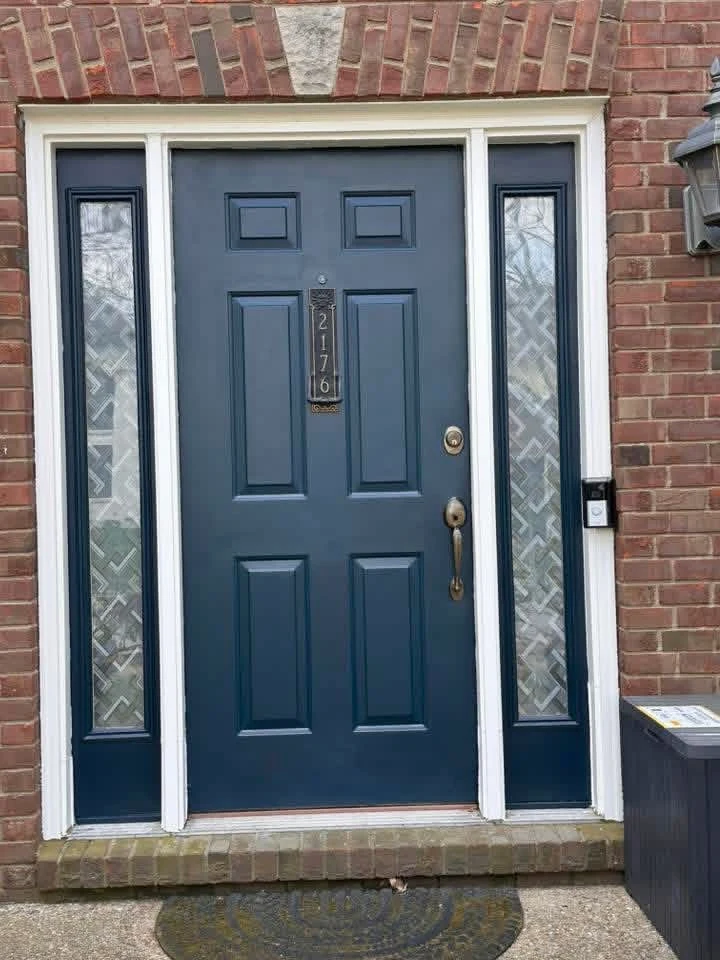 Blue front entry door and sidelights after a painting project