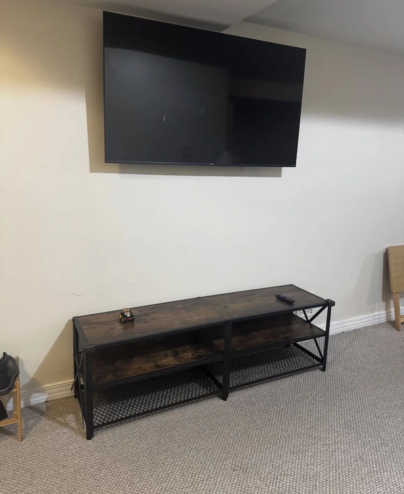 Television mounted above a media console by Arorix Home Solutions in Lexington Kentucky