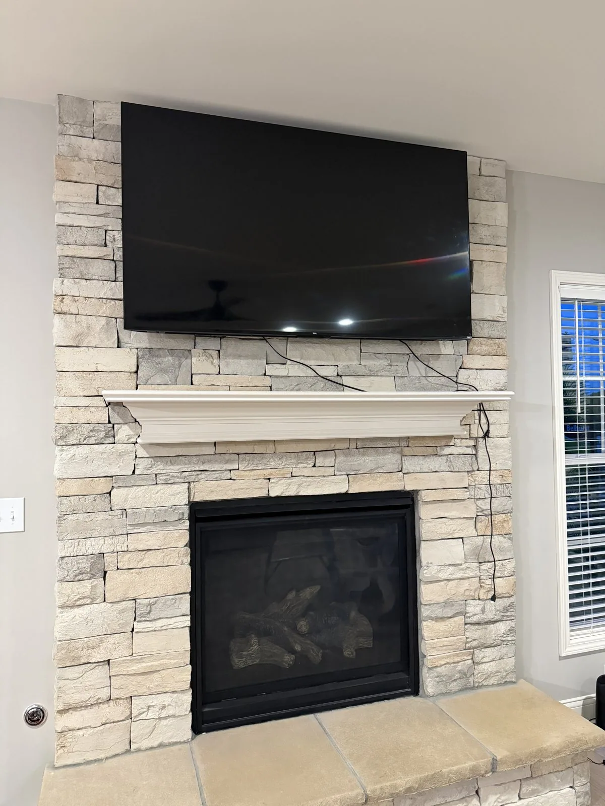 Television mounted above a fireplace by Arorix Home Solutions in Lexington Kentucky
